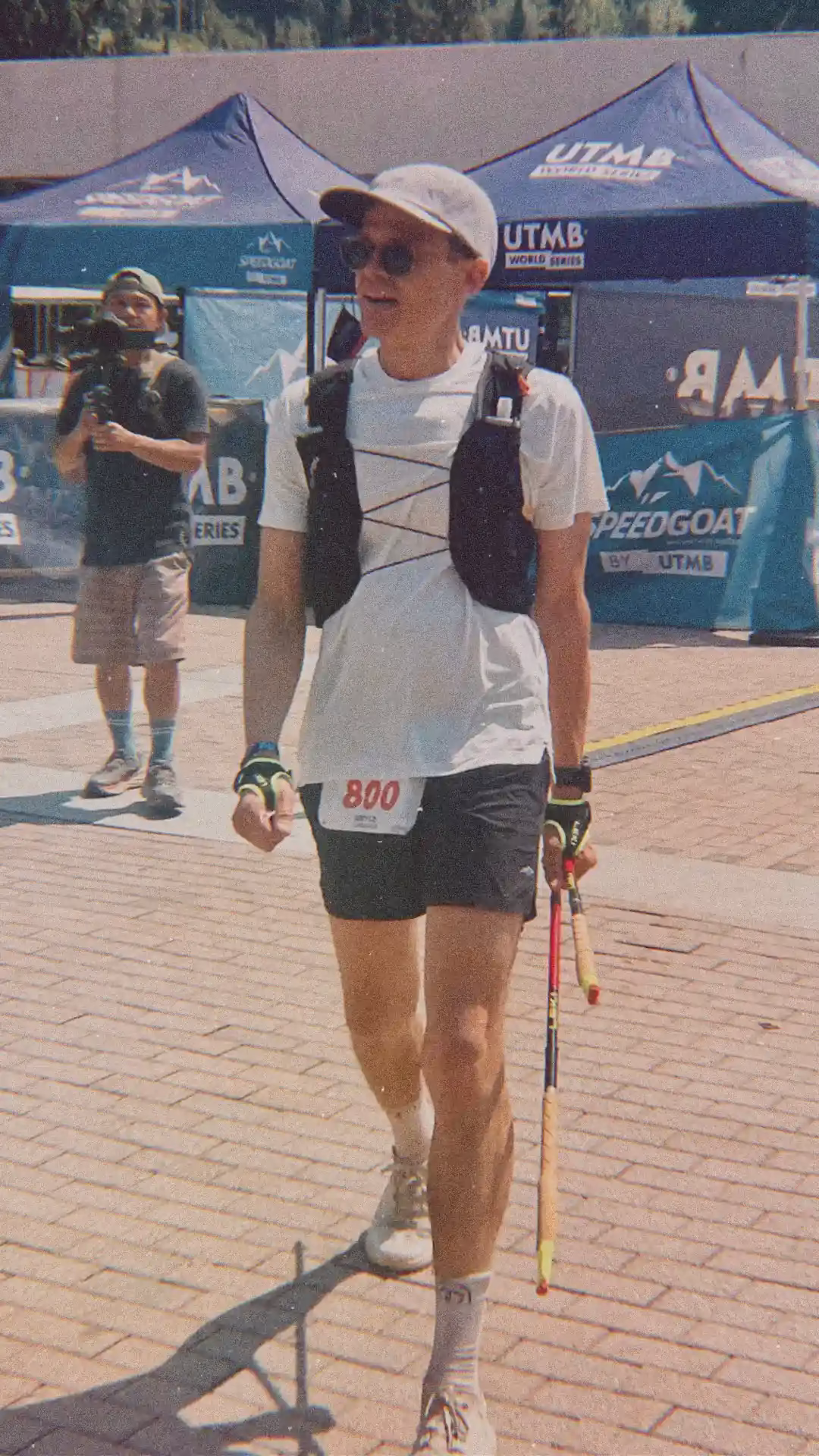 Man walking at the finish line of an ultramarathon.