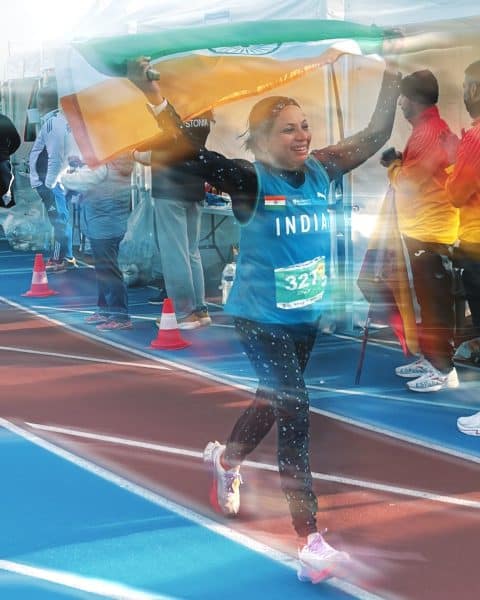 Runner celebrating with Indian flag