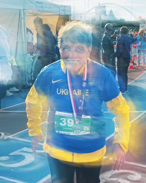 Runner wearing Ukraine jersey and medal.