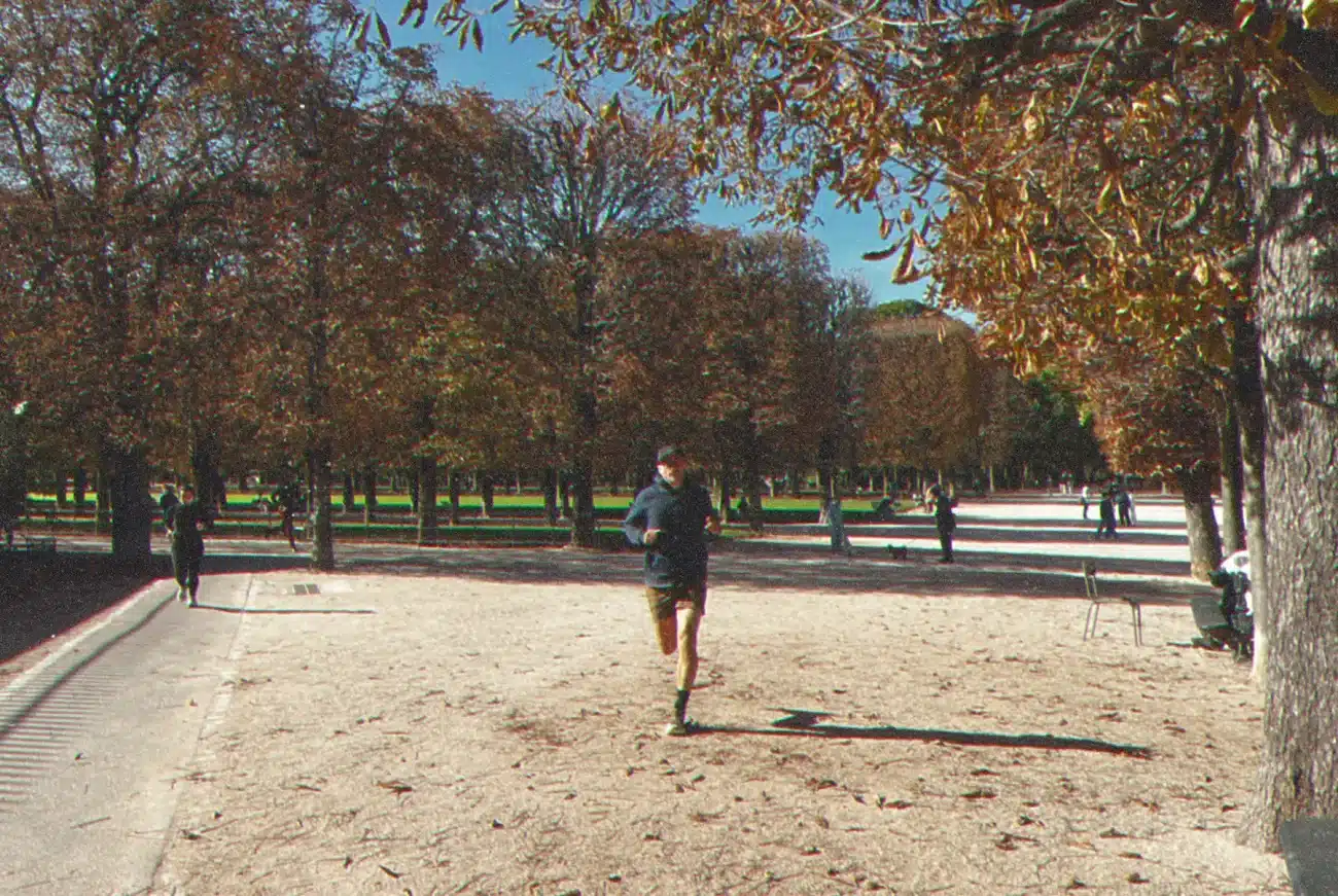Runner in a park with trees