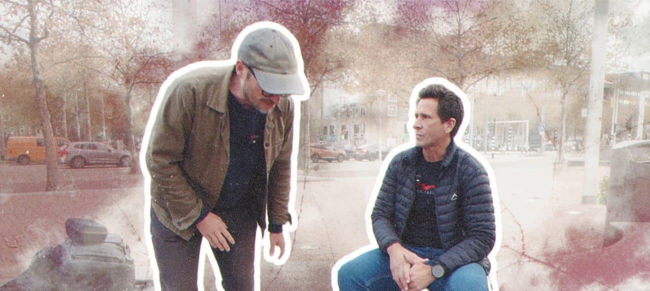Two friends in a city setting.