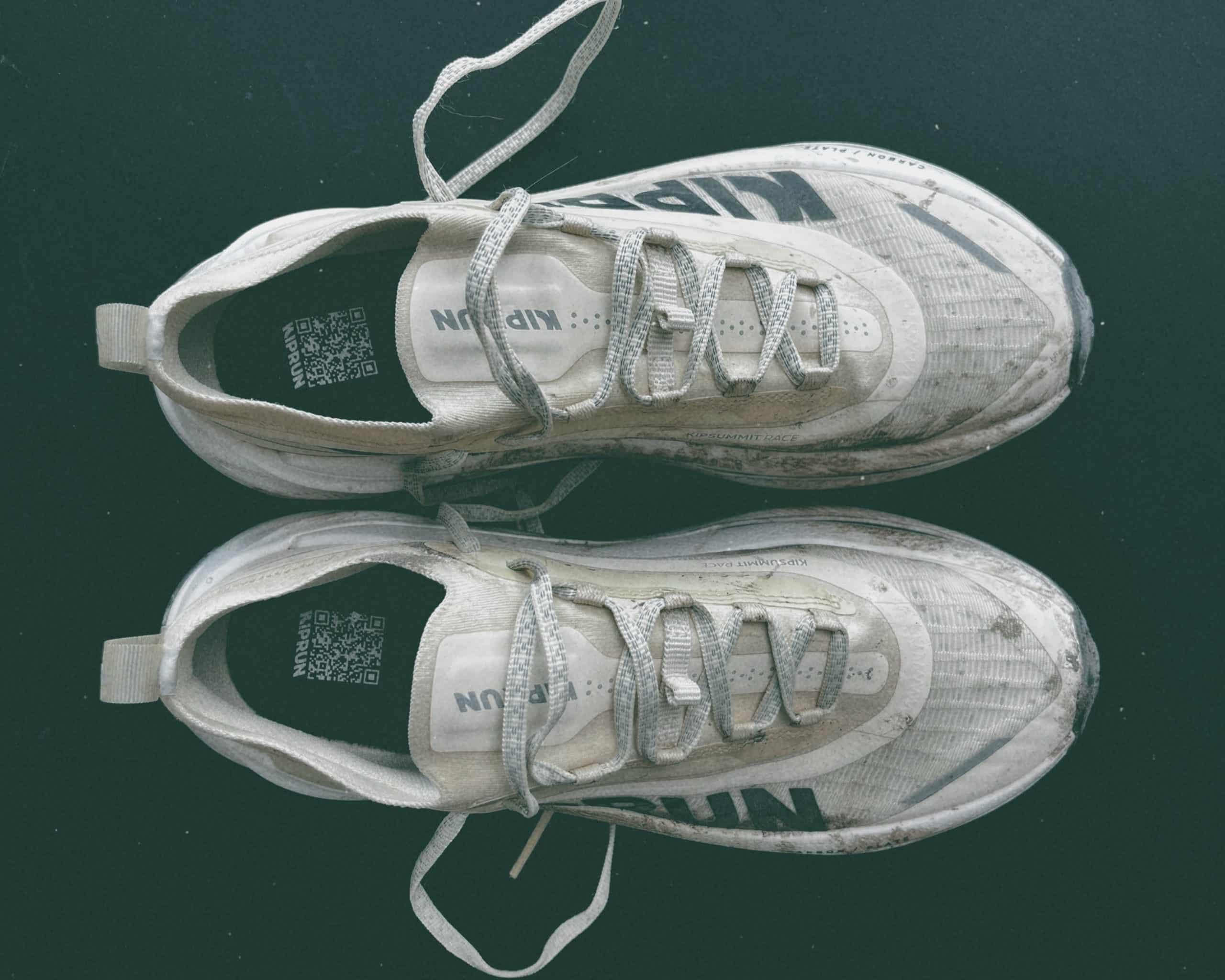 Worn-out white running shoes. Kiprun Kipsummit Race