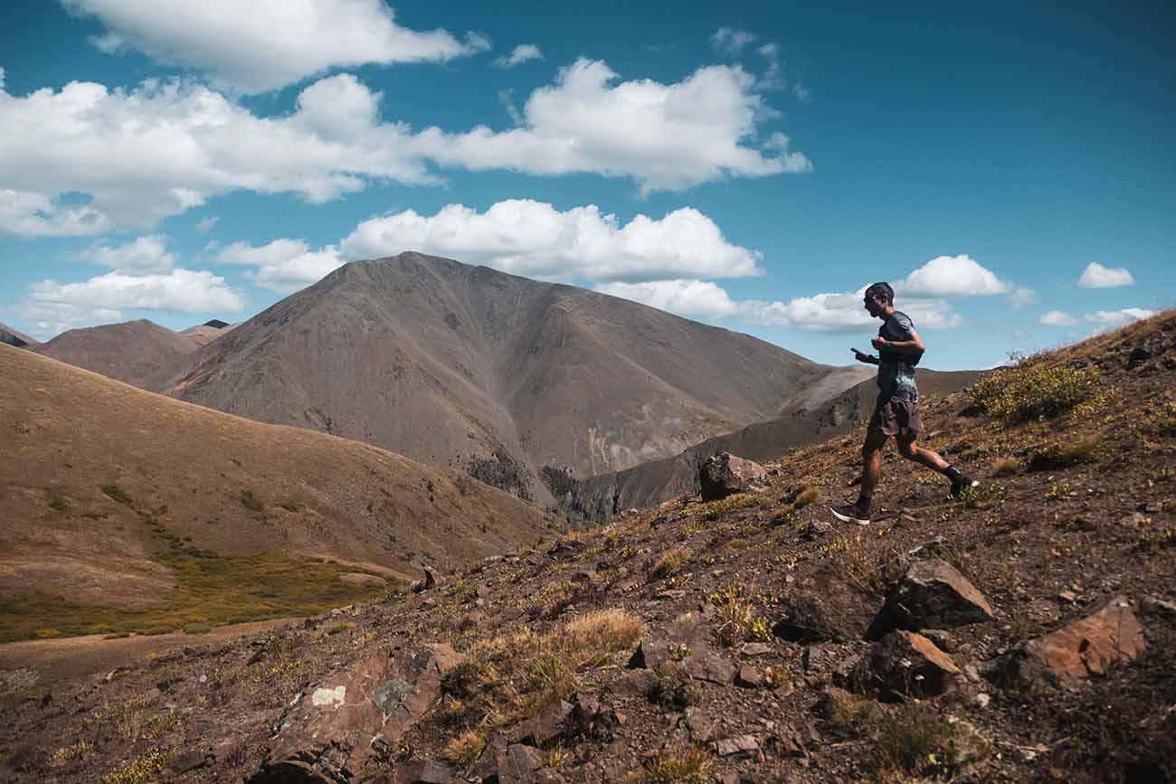 A man running down a mountain in Colorado