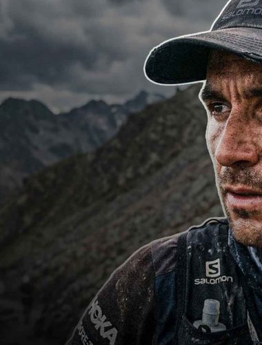 Determined athlete in rugged landscape.