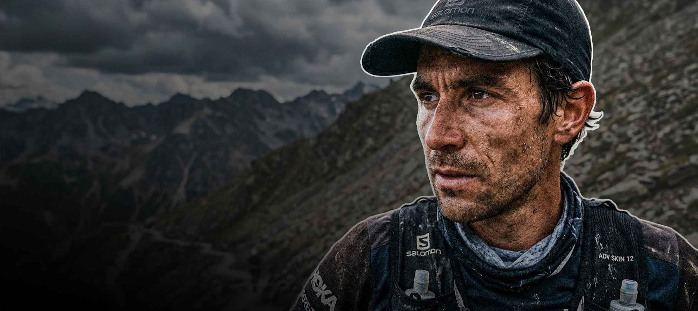 Determined athlete in rugged landscape.