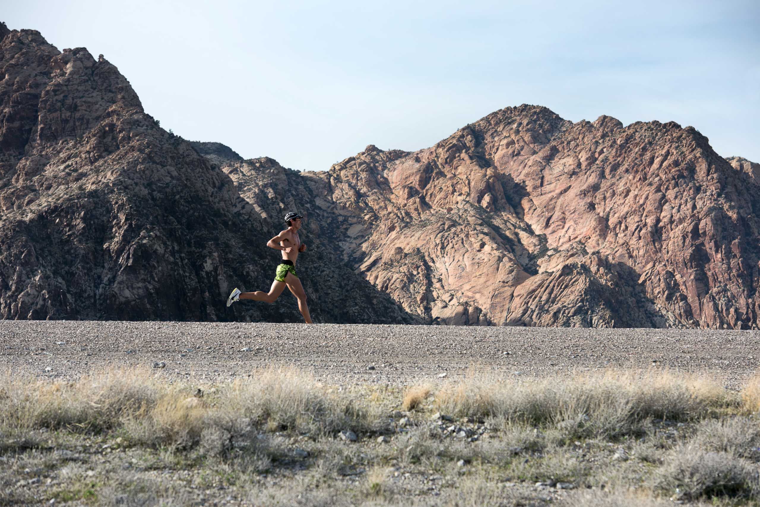 Runner in the dessert of the western united states with mountain behind